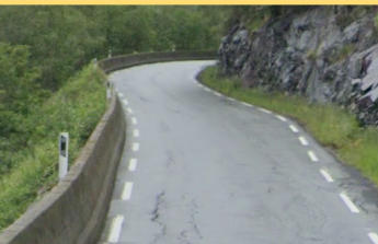 Delineator post on the left side of the road without a center divider