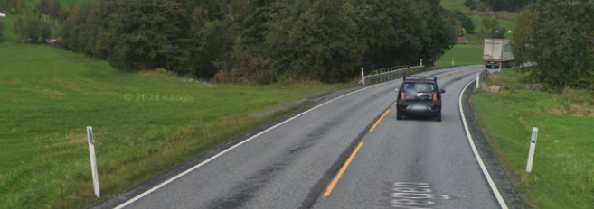 Delineator post on the left side of the road without a center divider
